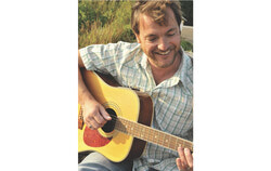 Singer-songwriter Chris Ronald, known for his poetic folk style and British Canadian roots, will bring his guitar and a new cross-country collaboration with fiddler Nathan Smith, to Motel Chelsea on October 12 at 4:30 pm. Photo: Courtesy