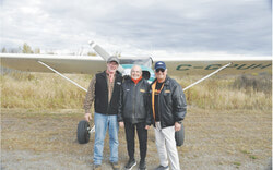 (From right) Richard Raymond, Maurice Prud’homme and Michael Dixon at the airfield on River Road at the Maurice Prud’homme fall event that came to be known as Mo’s Fly-in. Photo: Carl Hagar